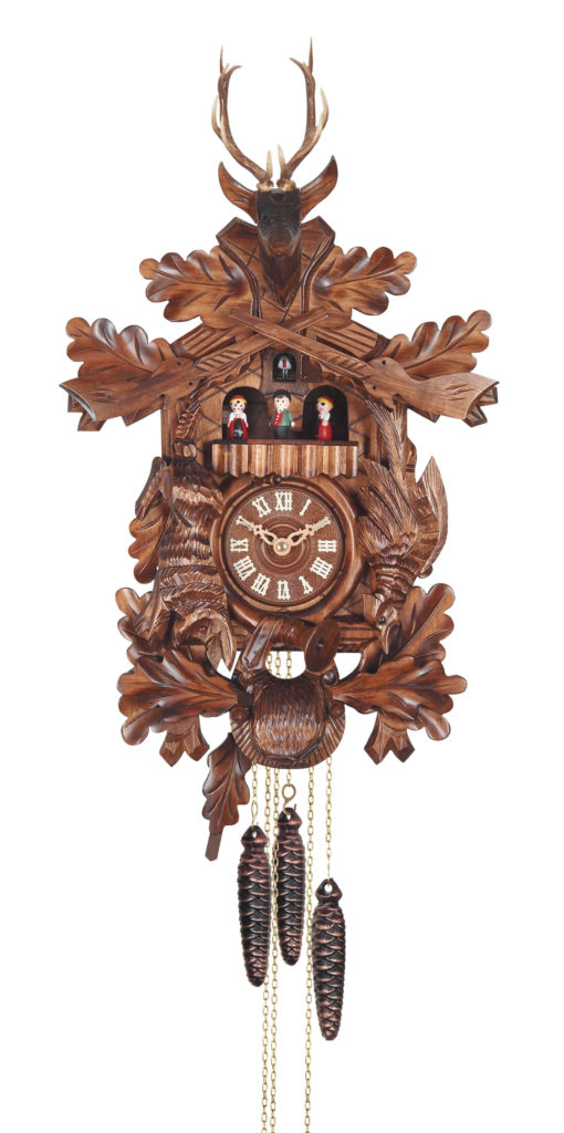 Quarz Cuckoo Clock (16 1/2 inches) with dancing figurines and carved dear head on top. Online